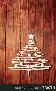 Birch branches and white stars in a shape of christmas tree. Eco Cristmas tree