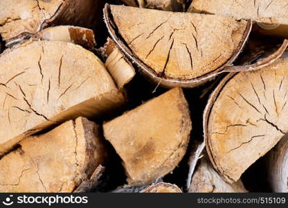 Birch logs lying on the ground. Top and side view.. Pile of a birch firewood