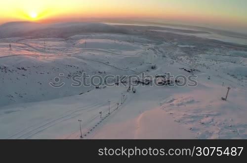 Bird eye view of sun rising over the ski resort in Khibiny mountains