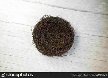 Bird nest empty top view, Easter Holliday decoration with copy space, white wooden background texture space for text. Bird nest empty top view, Easter Holliday decoration with copy space, white wooden background texture