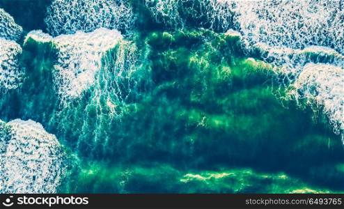 Bird&rsquo;s eye view on the open waters of planet earth, stormy seas, blue turquoise water of an ocean with waves and foam, abstract natural background, drone photography. Bird&rsquo;s eye view on the open waters of planet earth