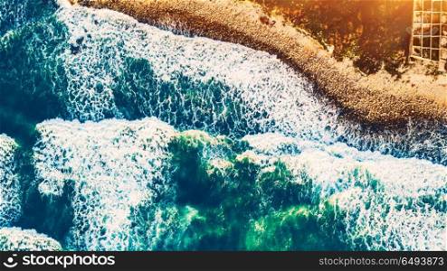 Bird&rsquo;s eye view on the open waters of planet earth, stormy seas, blue turquoise water of an ocean with waves and foam, abstract natural background, drone photography. Beach background