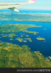 Birds eye. View from window of plane airplane flying over Norway Scandinavia.