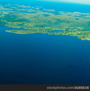 Birds eye. View from window of plane airplane flying over Norway Scandinavia.