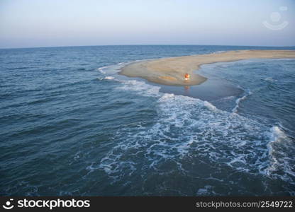 Birds eye view of couple on sandbar in Bald Head Island, North Carolina.