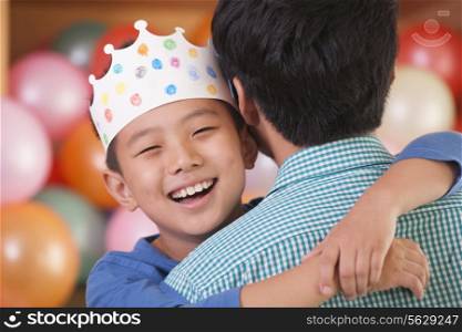 Birthday Boy Hugging His Father