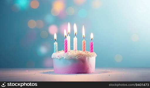 Birthday cake with burning candles on blue background with bokeh