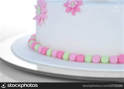 birthday cake with white frosting and flowers of cream