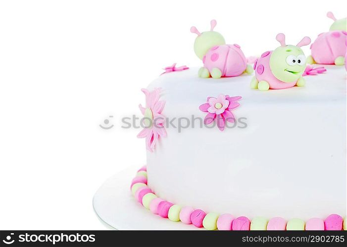 birthday cake with white frosting and ladybugs