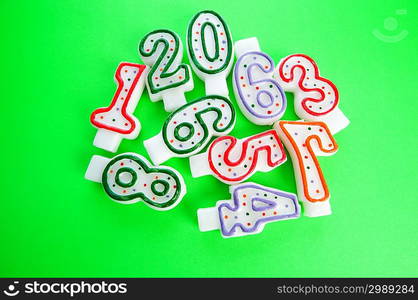 Birthday candles against colourful background