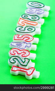 Birthday candles against colourful background