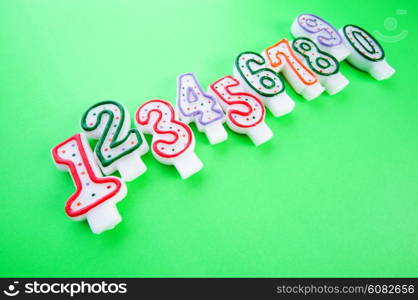 Birthday candles against colourful background