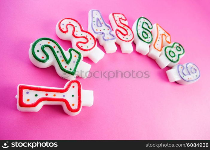 Birthday candles against colourful background