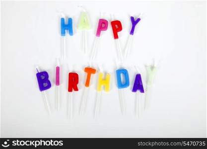 Birthday candles against white background