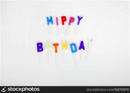 Birthday candles over white background