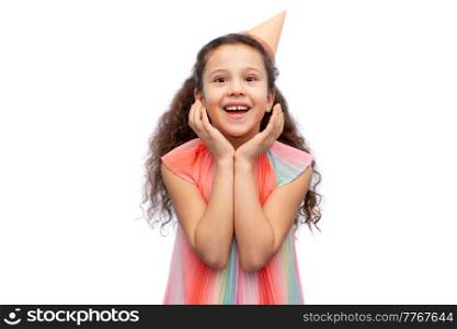 birthday, childhood and people concept - portrait of happy smiling little girl in dress and party hat over white background. happy smiling little girl in birthday party hat