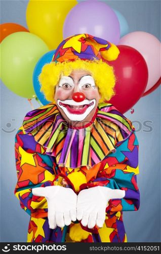 Birthday clown holds his hands open. Any gift or object can be added.