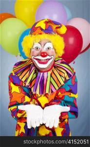 Birthday clown holds his hands open. Any gift or object can be added.