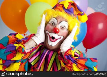 Birthday clown in full costume, looking surprised.