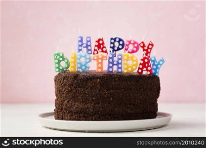birthday concept with chocolate cake cute candles