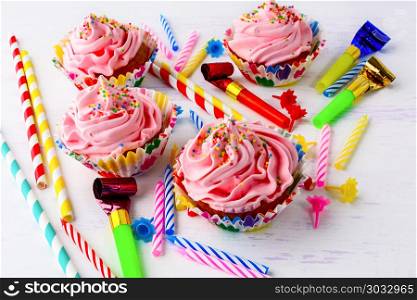 Birthday concept with pink cupcakes. Sweet gourmet pastry dessert. Homemade cupcakes with whipped cream. . Birthday concept with pink cupcakes