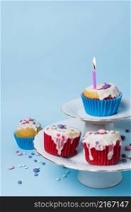 birthday cupcakes arrangement blue background
