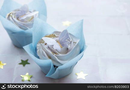 Birthday holiday sweet cupcakes with butterfly decorations