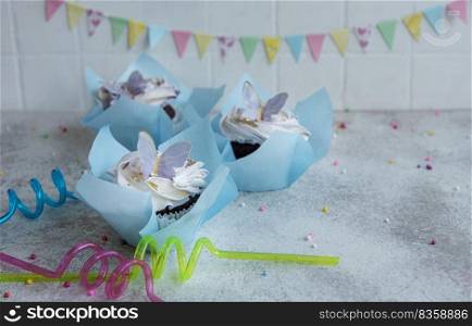 Birthday holiday sweet cupcakes with butterfly decorations