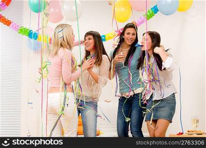 Birthday party celebration - four woman with confetti have fun, toast, dance