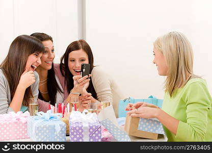 Birthday party - cheerful woman take photo with camera celebrating