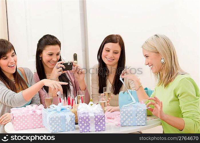 Birthday party - cheerful woman take photo with camera celebrating