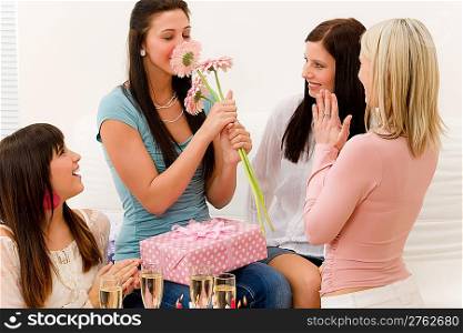 Birthday party - woman getting present and flower, surprise