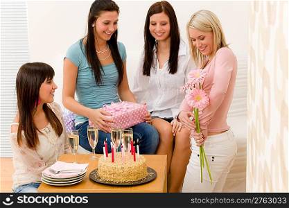 Birthday party - woman getting present and flower, surprise