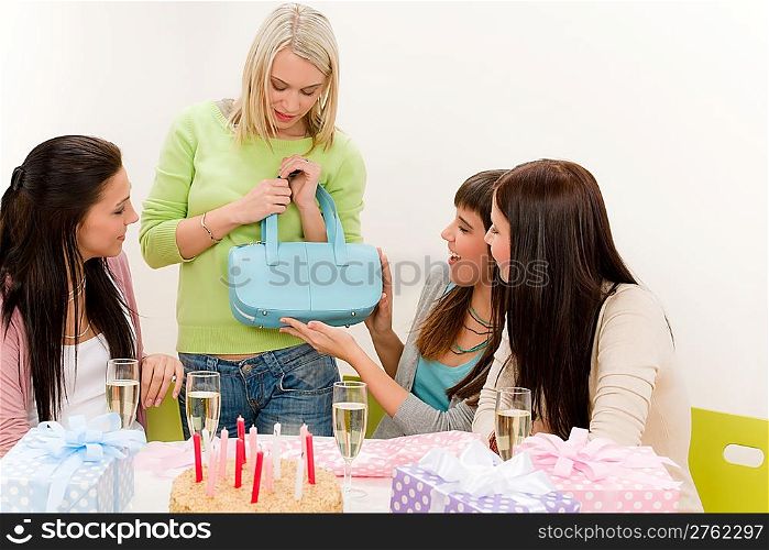 Birthday party - woman getting present, celebrate with cake and champagne