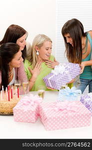 Birthday party - woman getting present with champagne and cake