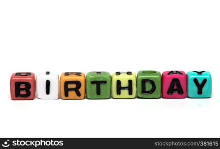birthday - word made from multicolored child toy cubes with letters