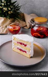 Biscuit cake with strawberry filling and tea