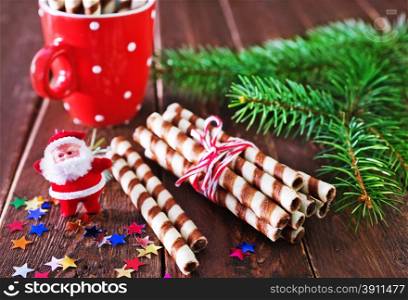 biscuit sticks and christmas decoration on a table