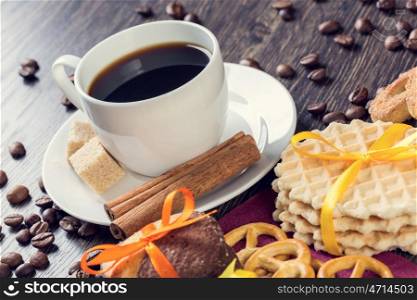 Biscuits and coffee on table. Assorted biscuits and sweets with a cup of coffee on table