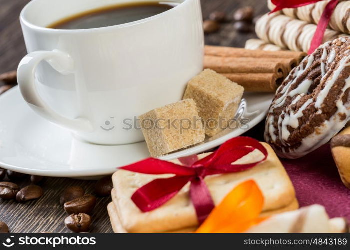 Biscuits and coffee on table. Assorted biscuits and sweets with a cup of coffee on table