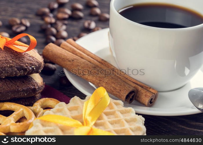 Biscuits and coffee on table. Assorted biscuits and sweets with a cup of coffee on table