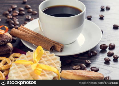 Biscuits and coffee on table. Assorted biscuits and sweets with a cup of coffee on table