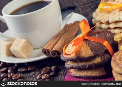 Biscuits and coffee on table. Assorted biscuits and sweets with a cup of coffee on table