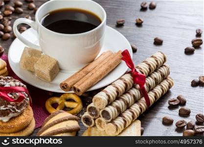 Biscuits and coffee on table. Assorted biscuits and sweets with a cup of coffee on table