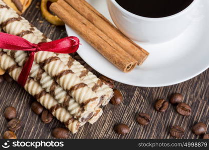 Biscuits and coffee on table. Assorted biscuits and sweets with a cup of coffee on table