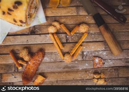 biscuits cake lying on a brown board rustic heart shaped breakfast for Valentine&rsquo;s Day for lovers.