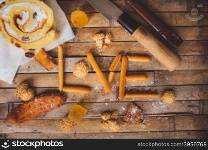 biscuits cake lying on a brown board rustic love shaped breakfast for Valentine&rsquo;s Day for lovers.