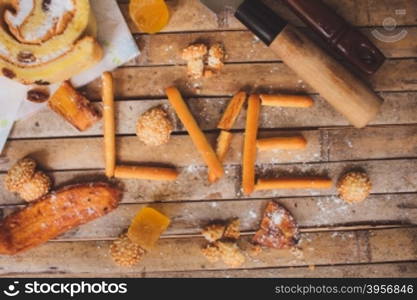 biscuits cake lying on a brown board rustic love shaped breakfast for Valentine&rsquo;s Day for lovers.