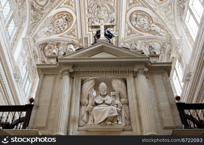 Bishop holding keys sculpture inside the Mezquita Cathedral in Cordoba, Andalusia, Spain.