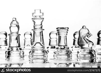 bishop, king, rook and knight chess pieces made out of glass